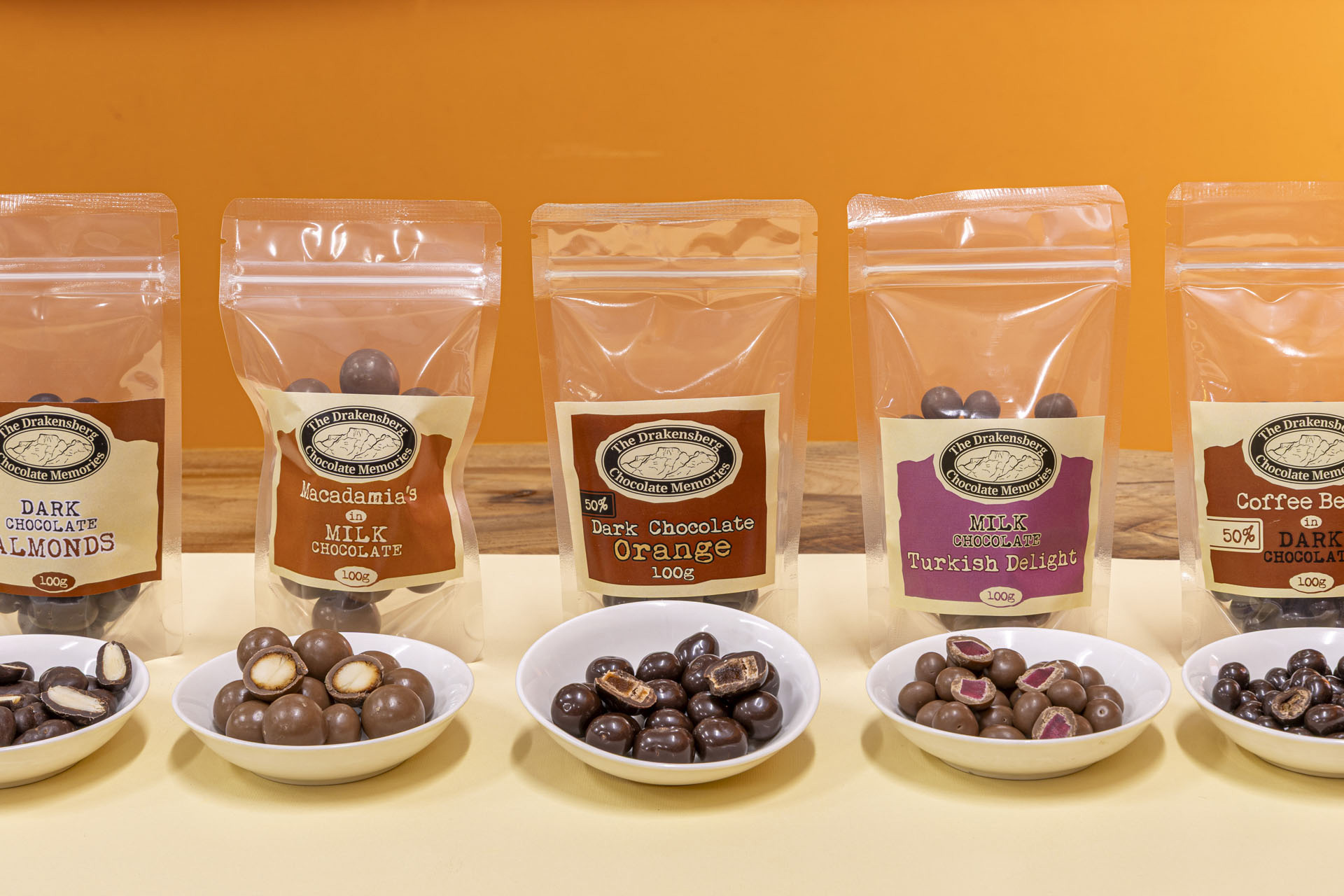 Assorted panned chocolates in decorative packaging